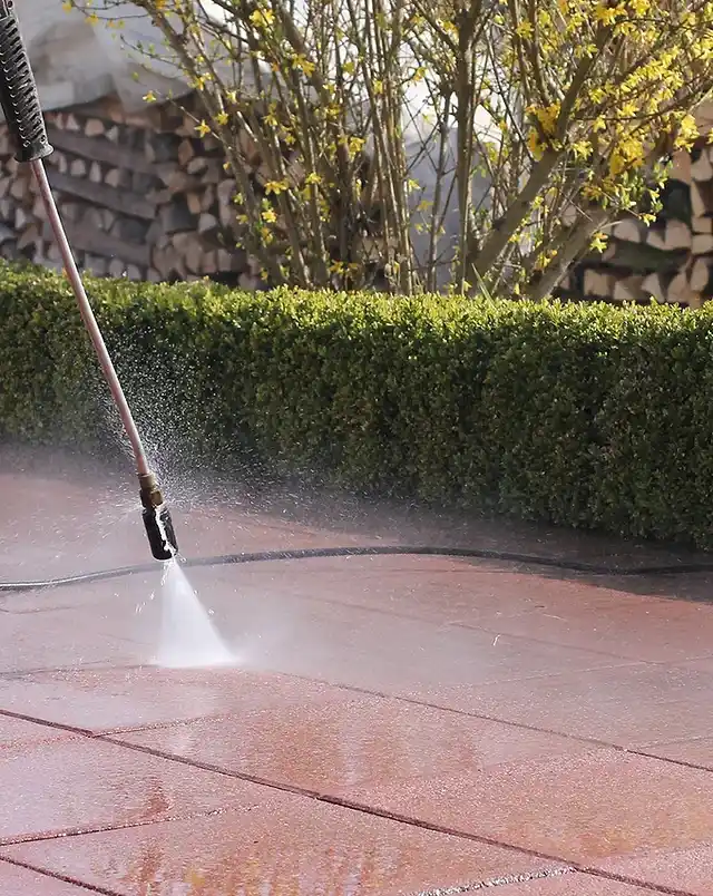 Professional pressure washing a stained driveway in Bendigo